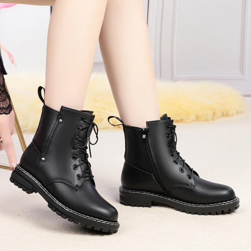Black genuine leather snow ankle boots for women with chunky rubber sole, perfect for autumn and winter casual wear.