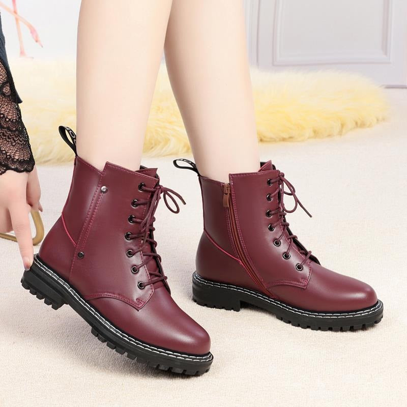 Burgundy genuine leather snow ankle boots for women with chunky rubber sole, ideal for autumn and winter fashion.