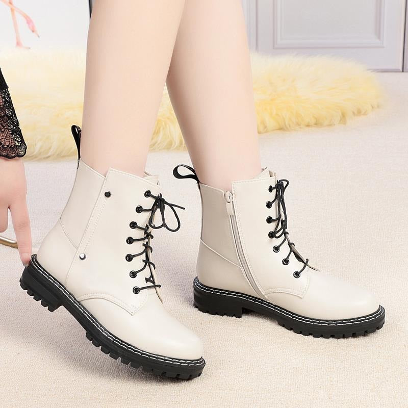 Stylish beige genuine leather snow ankle boots for women, featuring lace-up detail and chunky rubber sole.