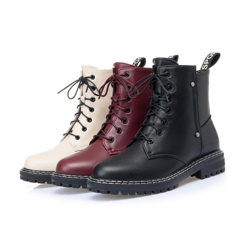 Genuine leather snow ankle boots for women in black, burgundy, and cream colors with chunky soles.