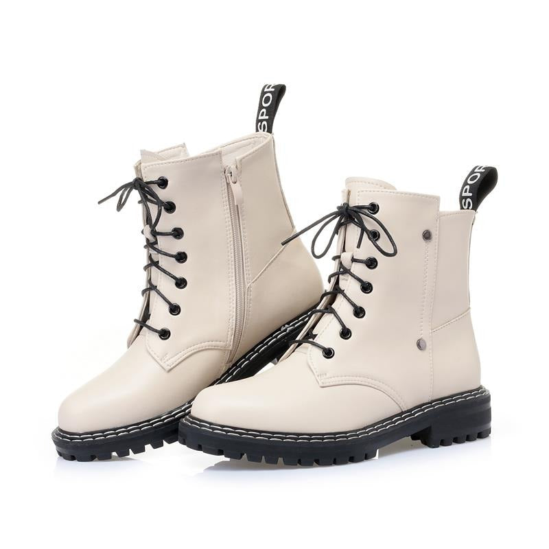 Genuine leather ankle boots for women, featuring lace-up design and chunky rubber sole for casual elegance.