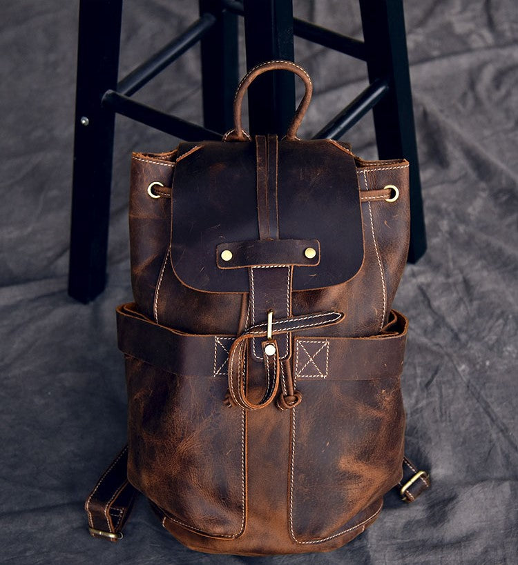 Stylish genuine leather travel backpack with pockets and straps, perfect for rock and steampunk fashion lovers.