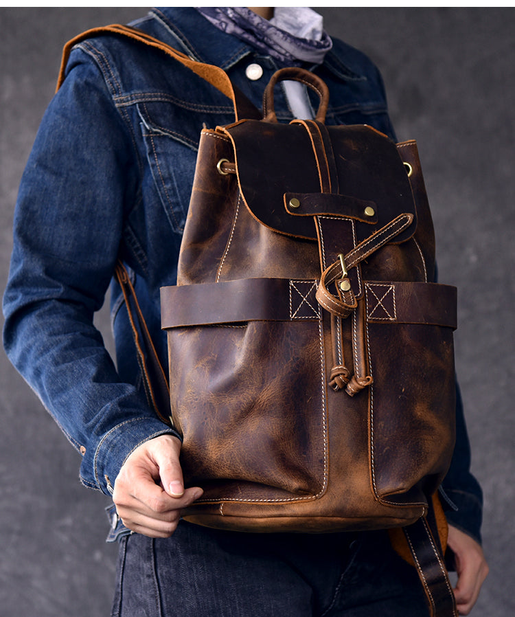 Genuine leather travel backpack for rock and steampunk fashion, featuring straps and a stylish design, perfect for any outfit.