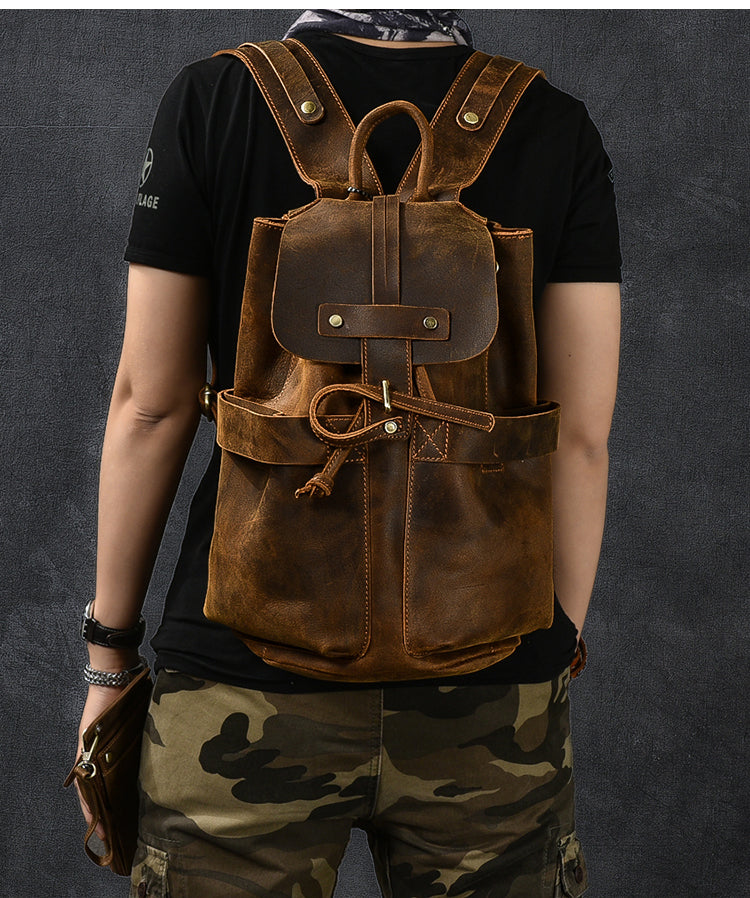 Genuine leather backpack in rustic brown with stylish straps, perfect for rock and steampunk fashion.