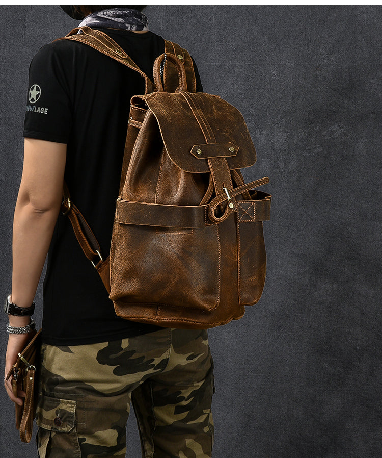 Genuine leather travel backpack in rock style, perfect for goth outfits, featuring straps and pockets.