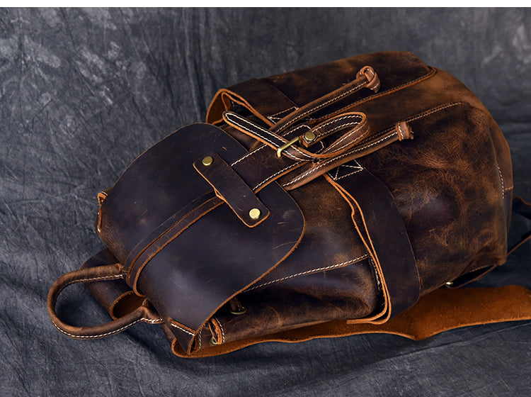 Genuine leather travel backpack in rock style with unique strapping and pockets, ideal for goth or punk outfits.