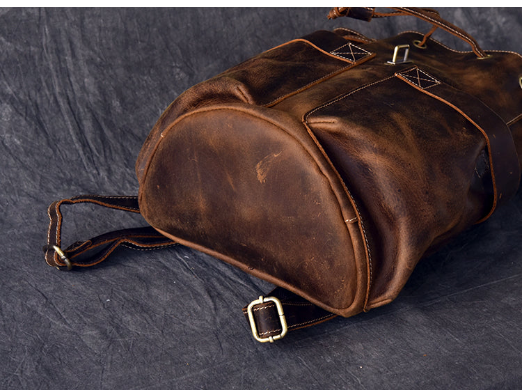 Genuine leather travel backpack showcasing rich brown texture and stylish buckles, perfect for rock and steampunk fashion.