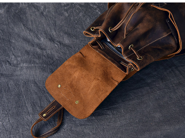 Interior view of a genuine leather rocker backpack highlighting the soft suede lining and stylish straps.