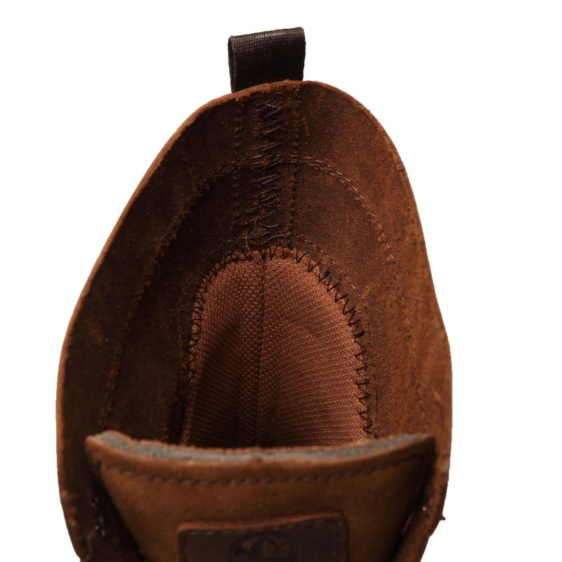 Inside view of genuine leather vintage ankle boots for men, showcasing soft lining and stitching details.