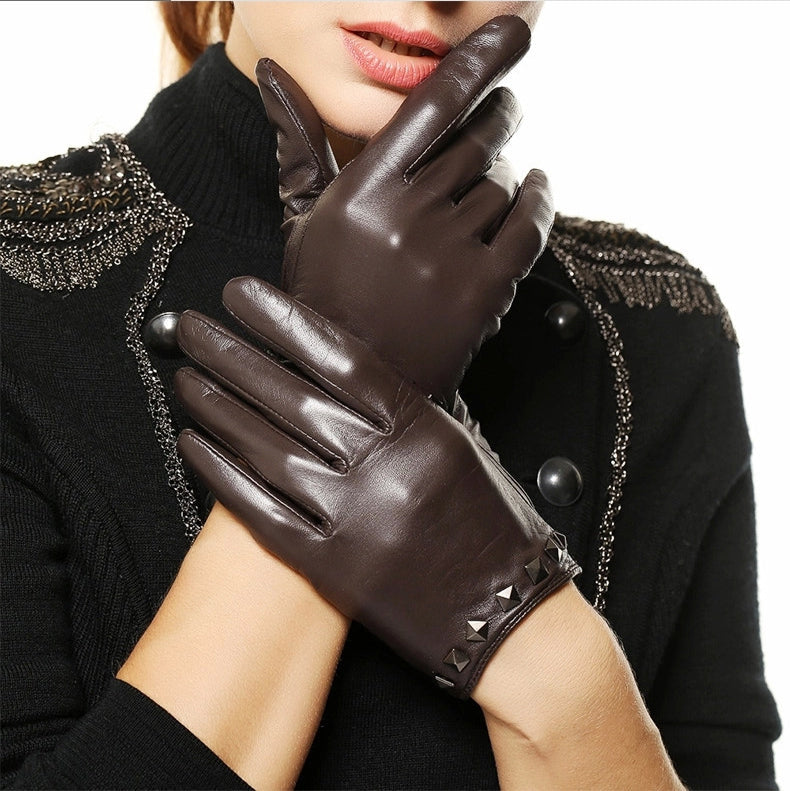 Stylish genuine leather women gloves with wrist rivets, perfect for festivals and drives, in a chic dark brown color.