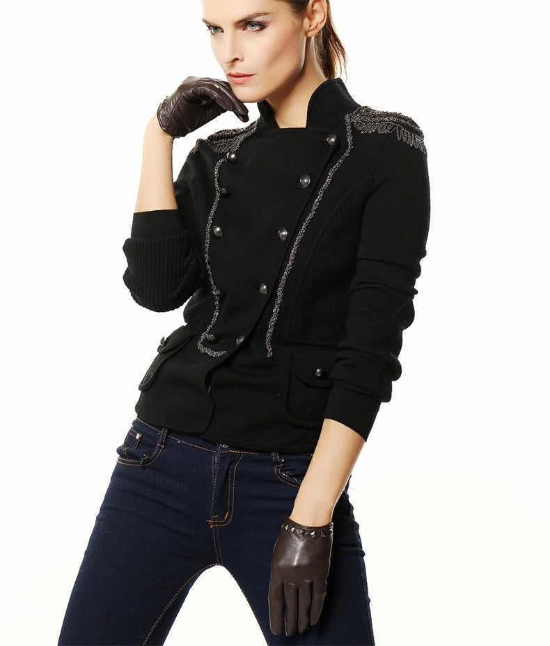 Stylish woman wearing genuine leather gloves with a chic black jacket, perfect for alternative fashion looks.