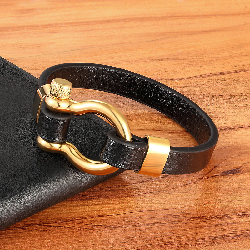 Stylish geometic circle toggle clasps genuine leather bracelet on a wooden surface, perfect for rock style looks.