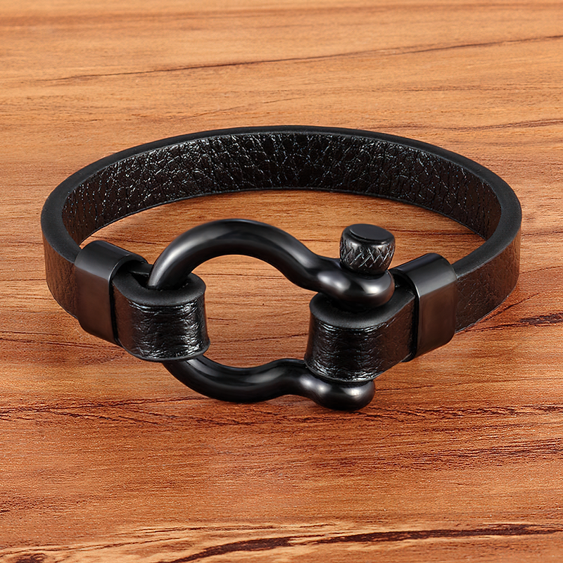 Black leather bracelet with geometric circle toggle clasp for a rock style look.