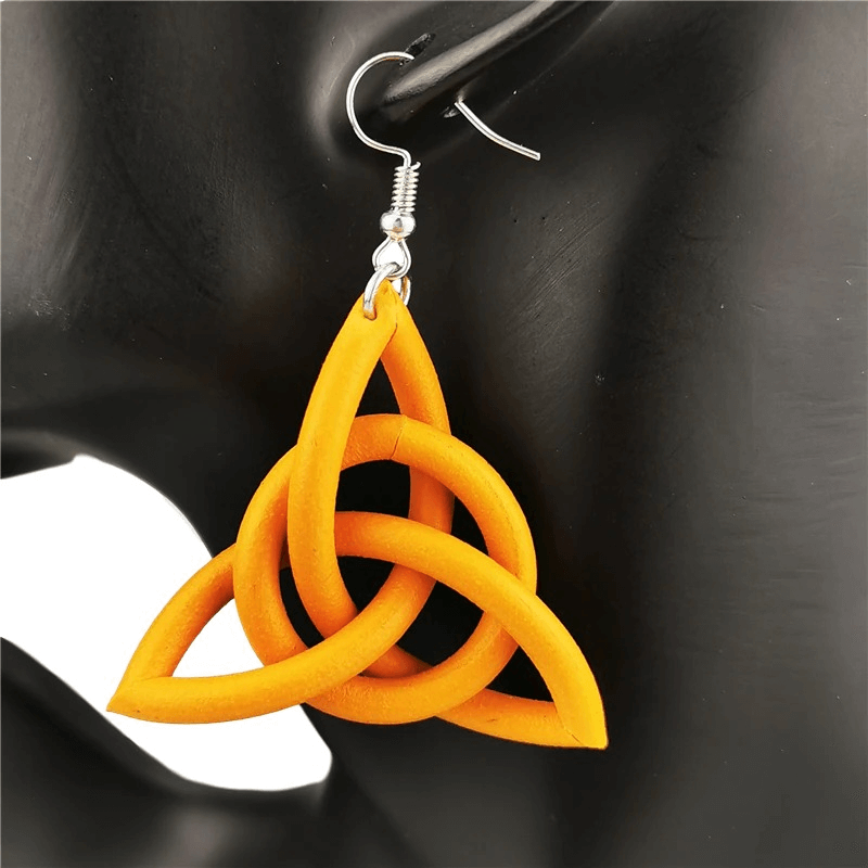 Geometric drop earrings in vibrant orange, handmade ethnic accessory for women, adding charm to any outfit.