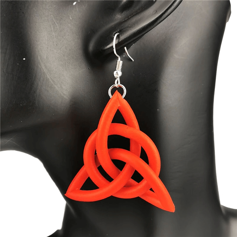 Handmade geometric drop earrings in vibrant red, perfect ethnic accessory for a stylish look.