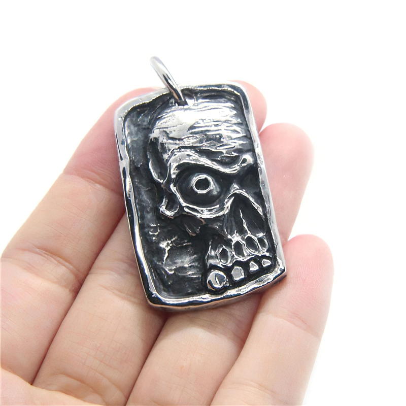 Unisex stainless steel ghost skull pendant, gothic fashion jewelry, stylish accessory for men and women.