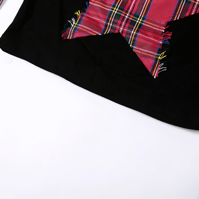 Close-up of goth dark pentagram patchwork t-shirt featuring red plaid design on black fabric.