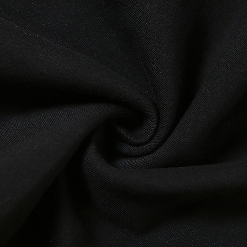 Close-up of soft black fabric showcasing its smooth texture, ideal for grunge style t-shirts.