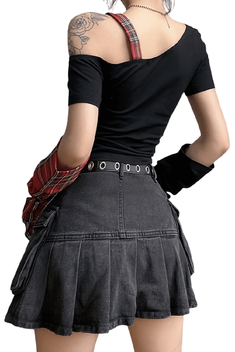 Stylish back view of a grunge one-shoulder black t-shirt paired with a chic pleated denim skirt.