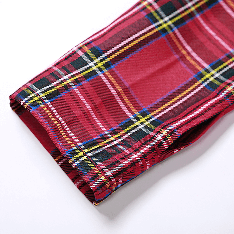 Close-up of a plaid red fabric showing a stylish patchwork design perfect for grunge fashion.