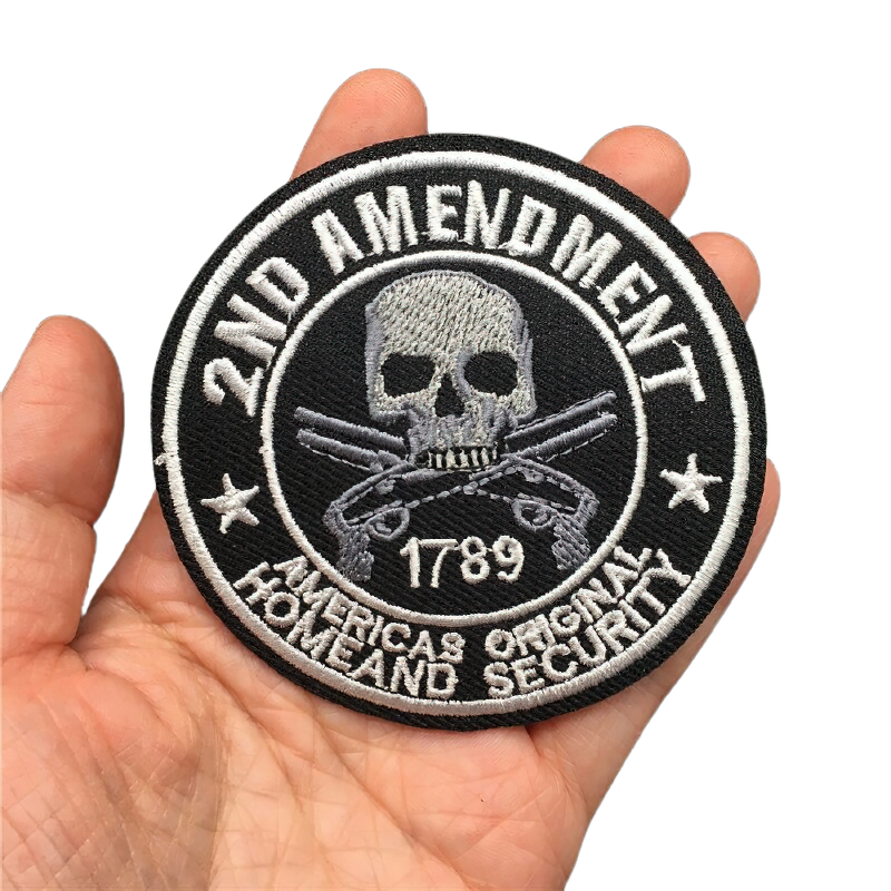 Unisex skull patch with crossed weapons, representing rock style and the 2nd Amendment, perfect for fashion accessories.