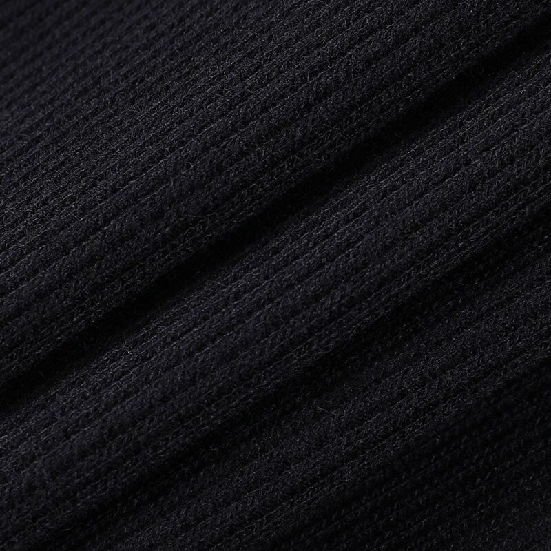 Close-up of soft black ribbed fabric perfect for women's gothic asymmetrical tank tops.