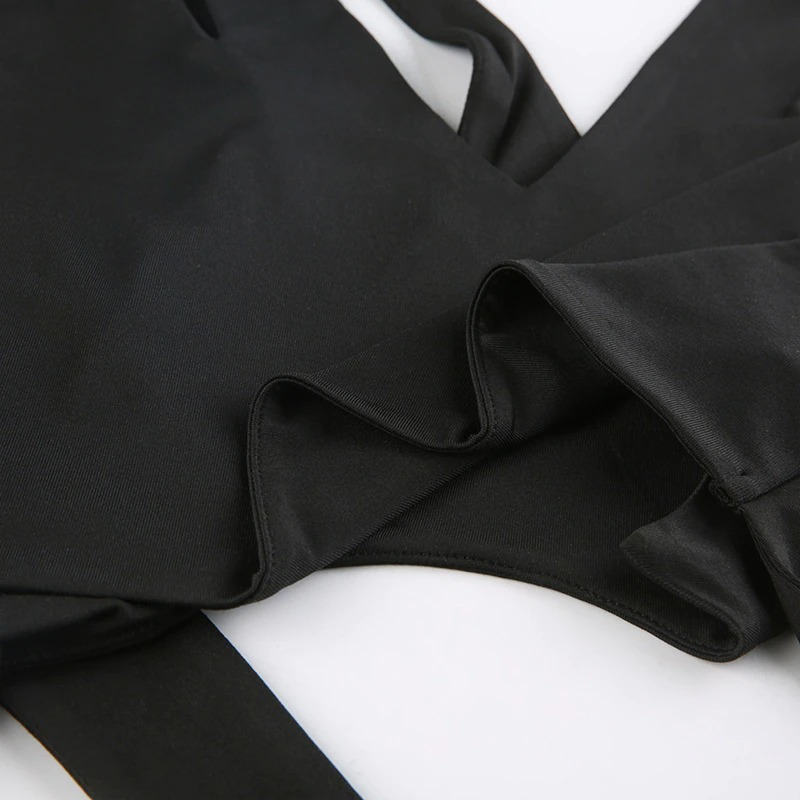 Close-up of a black goth cut-out crop top showcasing its sleek fabric and stylish design elements.