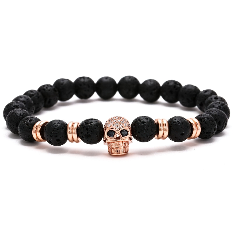 Stylish unisex gothic bracelet with black beads and a sparkling skull head accent.