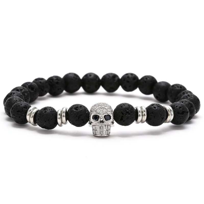 Stylish unisex gothic bracelet featuring dark beads and a sparkling skull head accent.