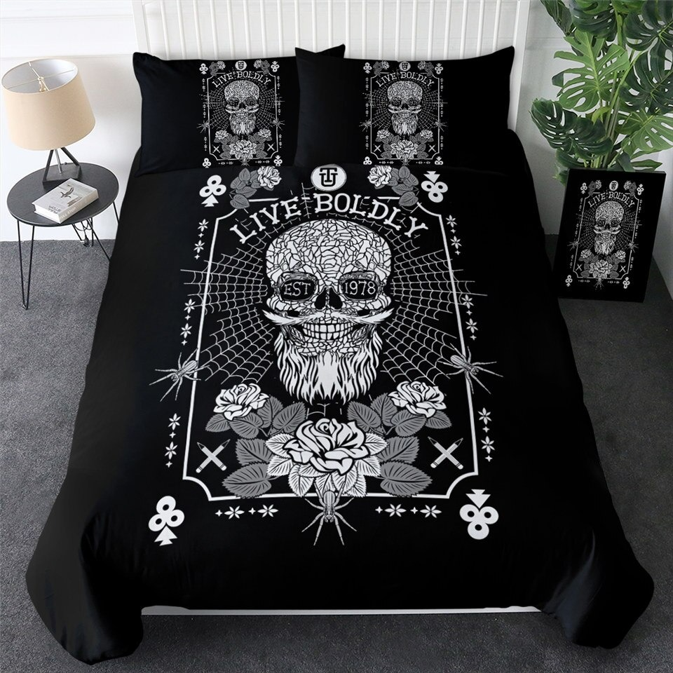Gothic bedding set with skull design, black duvet cover, and decorative pillowcases in a stylish bedroom setting.