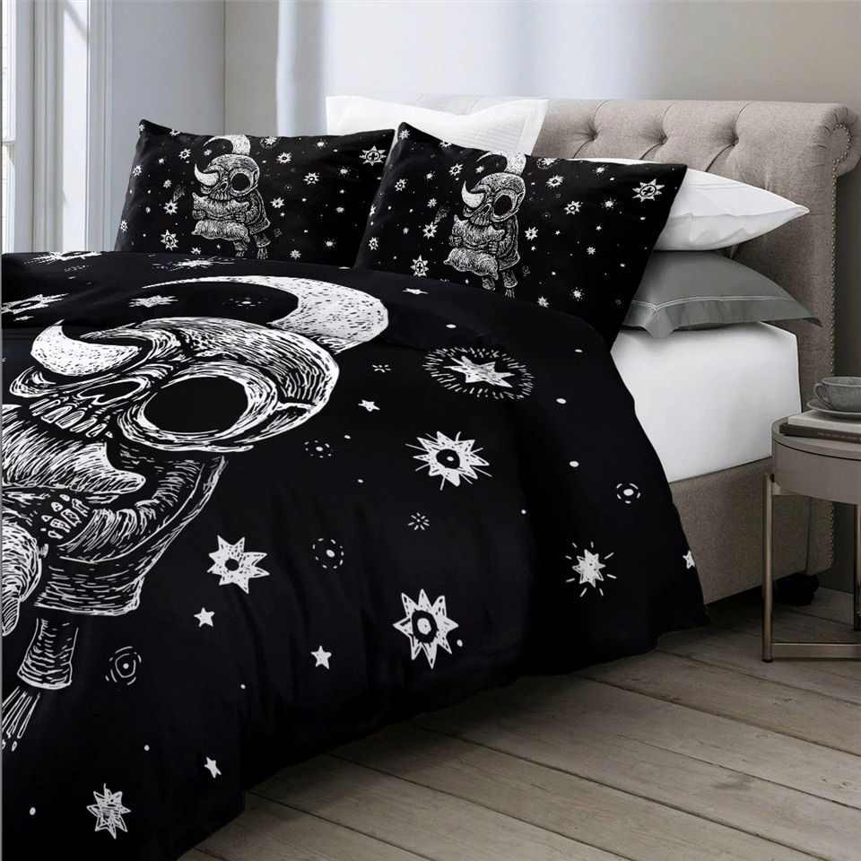 Gothic bedding set featuring skull and moon print on a black duvet cover with decorative pillows.