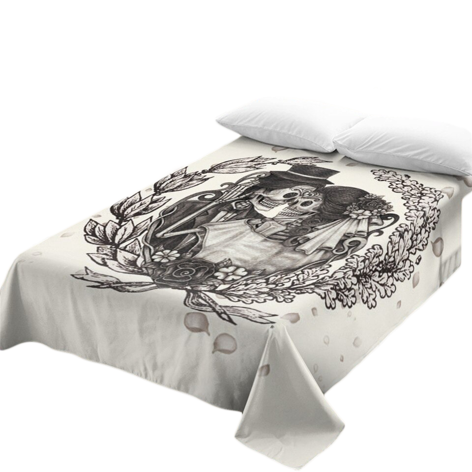 Stylish gothic bedspread with skull and floral print, perfect for vintage home decor.