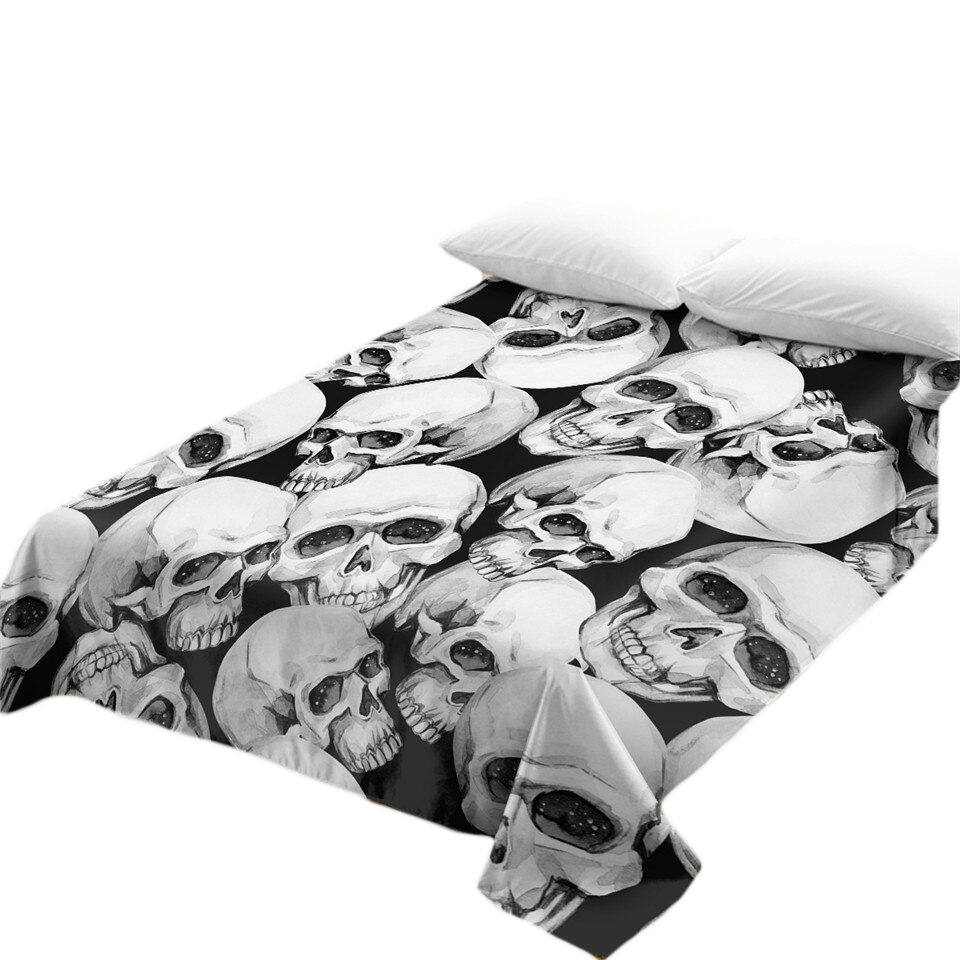 Gothic bedspread featuring a striking skull print on a dark background, perfect for stylish home decor.