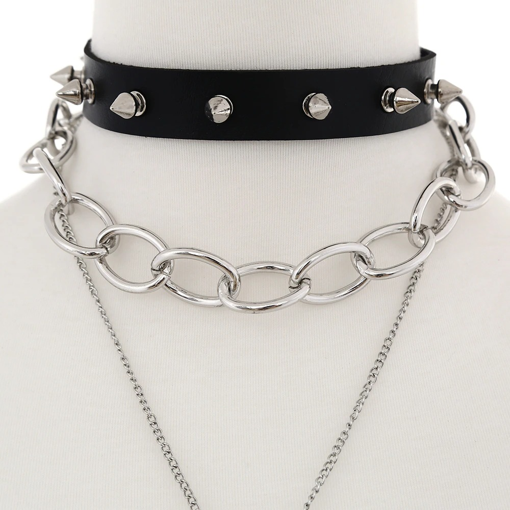 Gothic black choker necklace with spikes and silver chain, perfect for vintage and alternative fashion outfits.