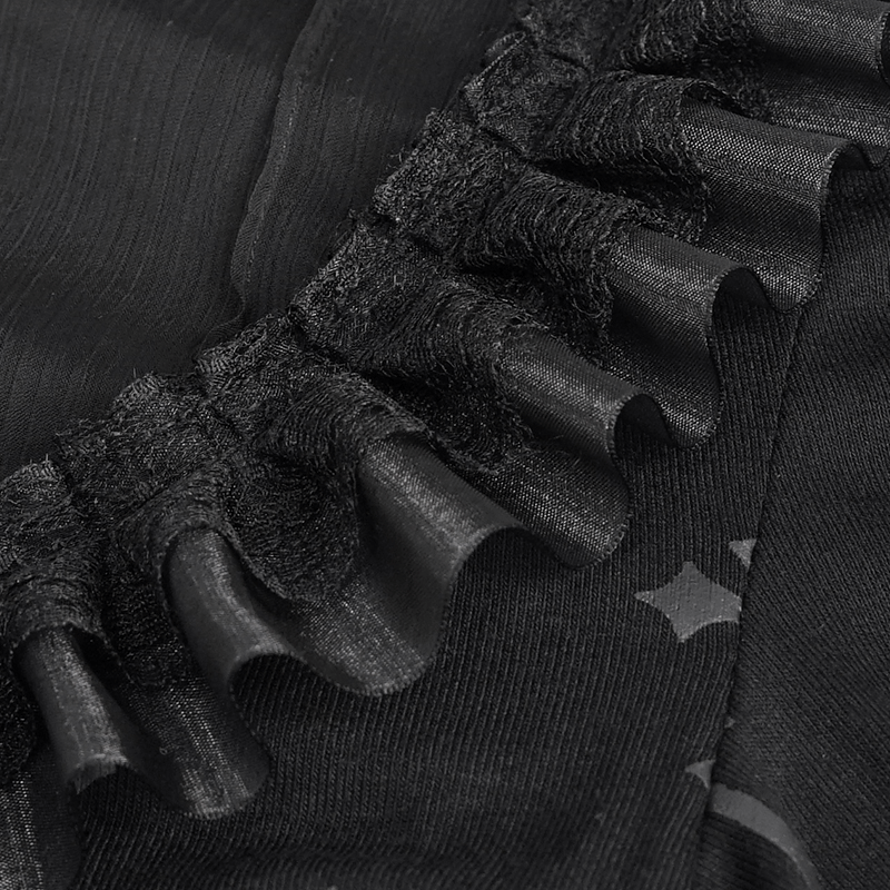 Close-up of the lace trim on a gothic black blouse showcasing elegant ruffles and luxurious texture.