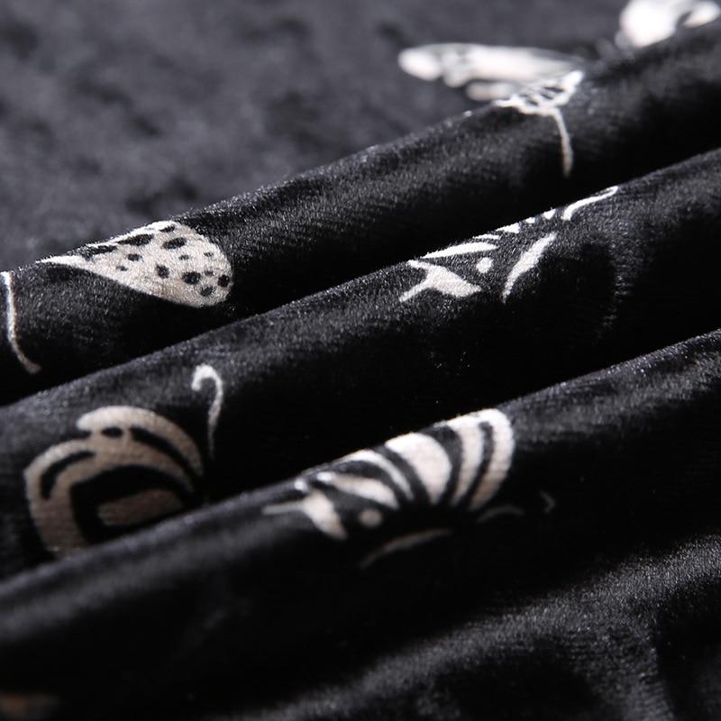 Close-up of black fabric featuring delicate butterfly patterns, perfect for a gothic backless dress for women.