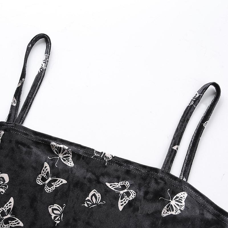 Close-up of black gothic dress straps with silver butterfly print, perfect for alternative fashion.