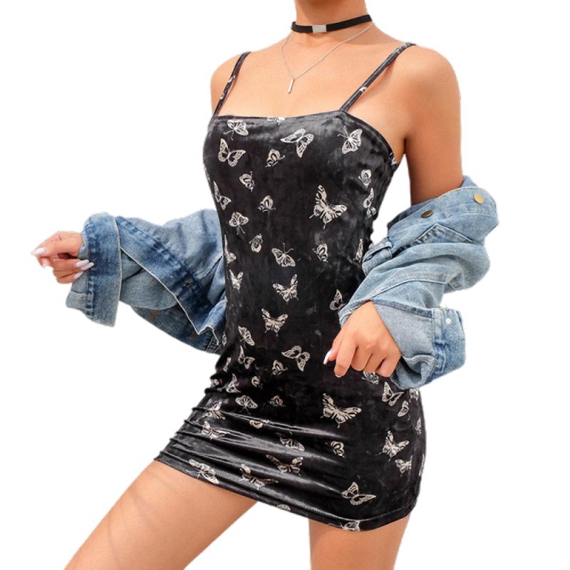 Gothic black dress with butterfly print, backless and sleeveless, styled with a denim jacket for a trendy alternative fashion look.
