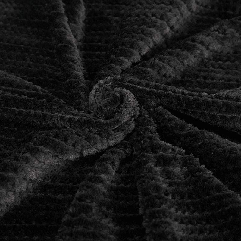 Close-up of soft black fleece fabric, perfect for a gothic hooded cape with a luxurious texture.