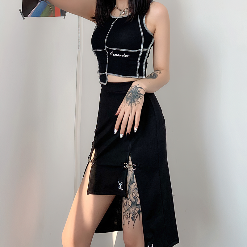 Gothic black knee-length women's skirt with hollow outs and high waist, styled with a cropped top.