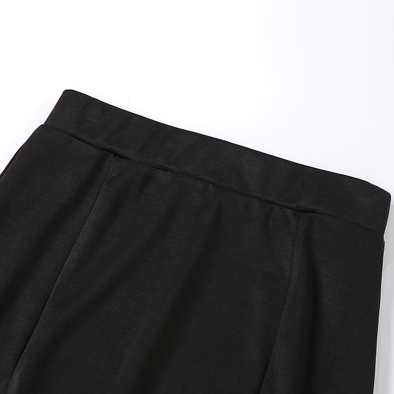 Close-up of the high waist of a Gothic black knee-length women's skirt with a sleek design.