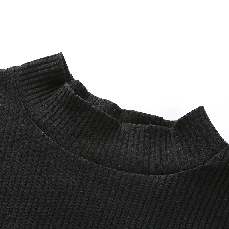 Close-up of the neckline of a gothic black mesh crop top showcasing ribbed texture and modern design.