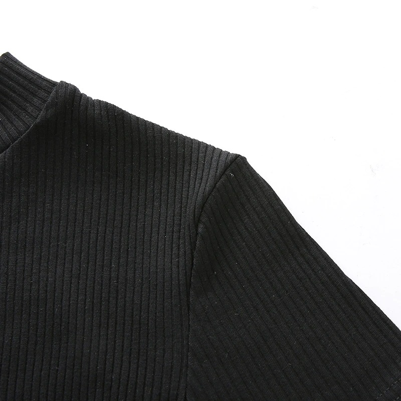 Close-up of a gothic black ribbed crop top, showcasing its stylish short sleeve and modern design for a trendy punk aesthetic.