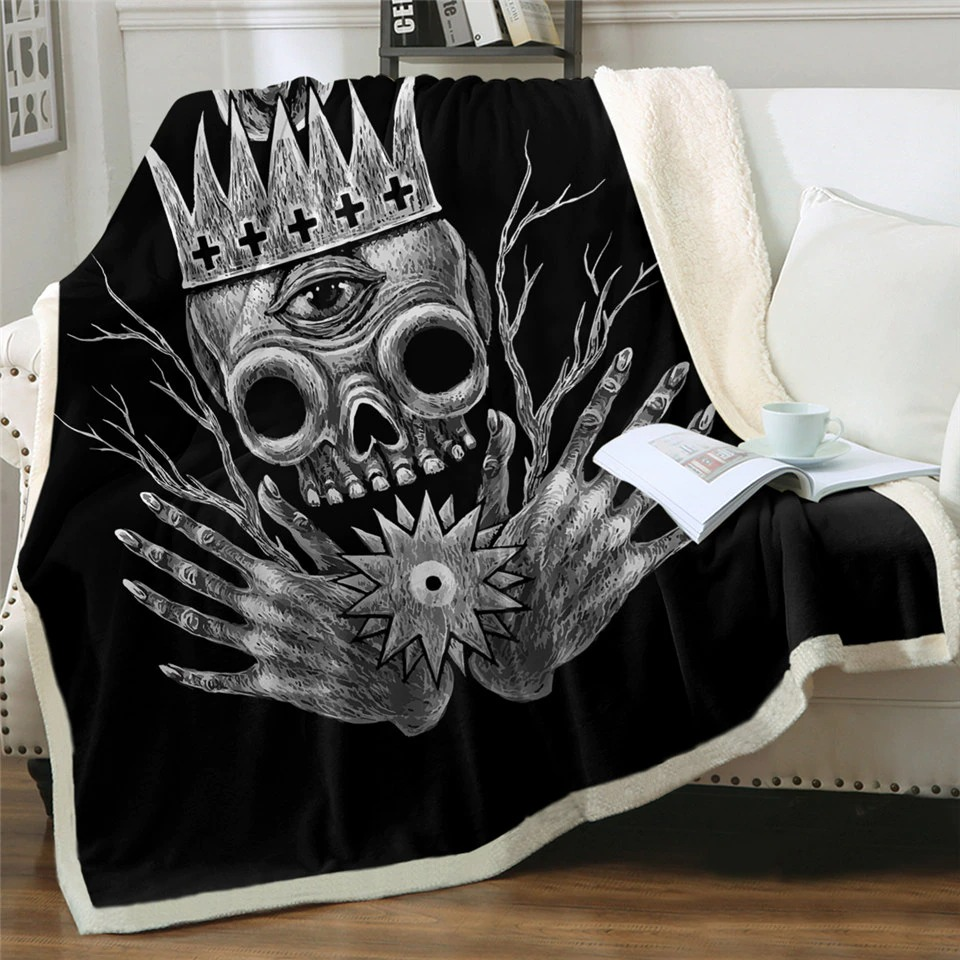 Gothic black plush blanket with skull and crown design, perfect for cozying up in style.
