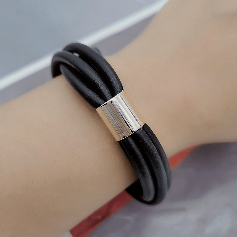 Stylish gothic black rubber bangle for women featuring a sleek silver accent, adding vintage charm to any outfit.