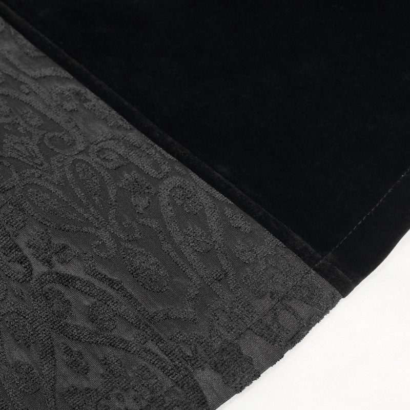 Close-up of gothic black coat fabric showcasing rich floral embroidery and textured velvet design.