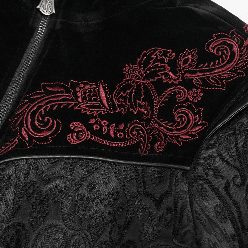 Close-up of gothic black coat with intricate red floral embroidery on stand collar for alternative fashion.