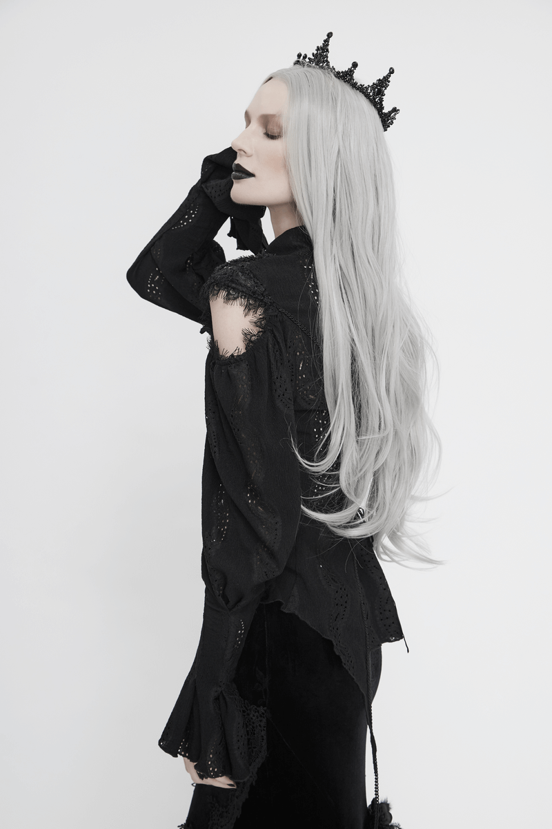 Stylish woman in black attire wearing a gothic black stone studded tiara, showcasing a vintage hair accessory.