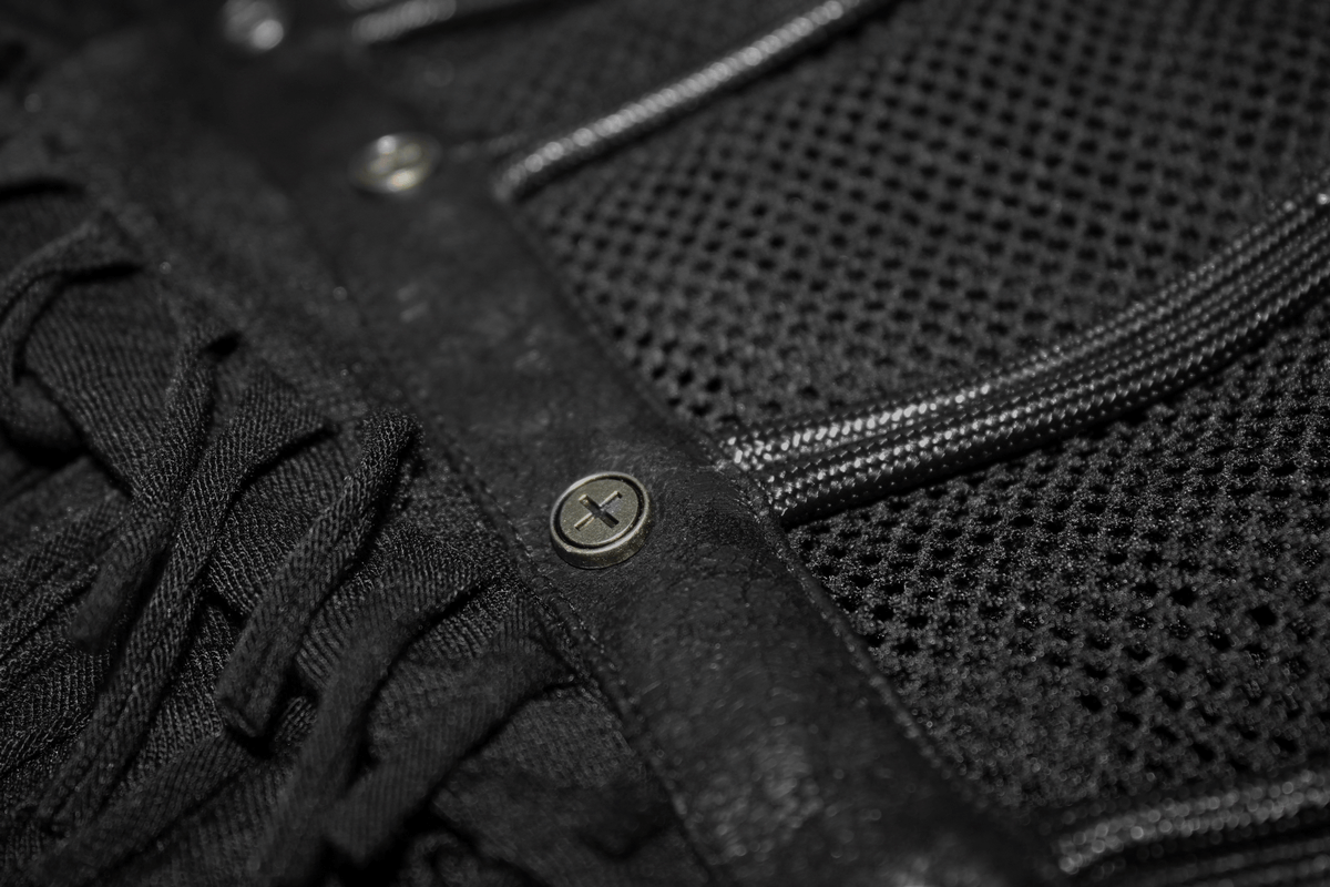 Close-up of gothic black t-shirt details with fringes, mesh, and studs for a stylish look.