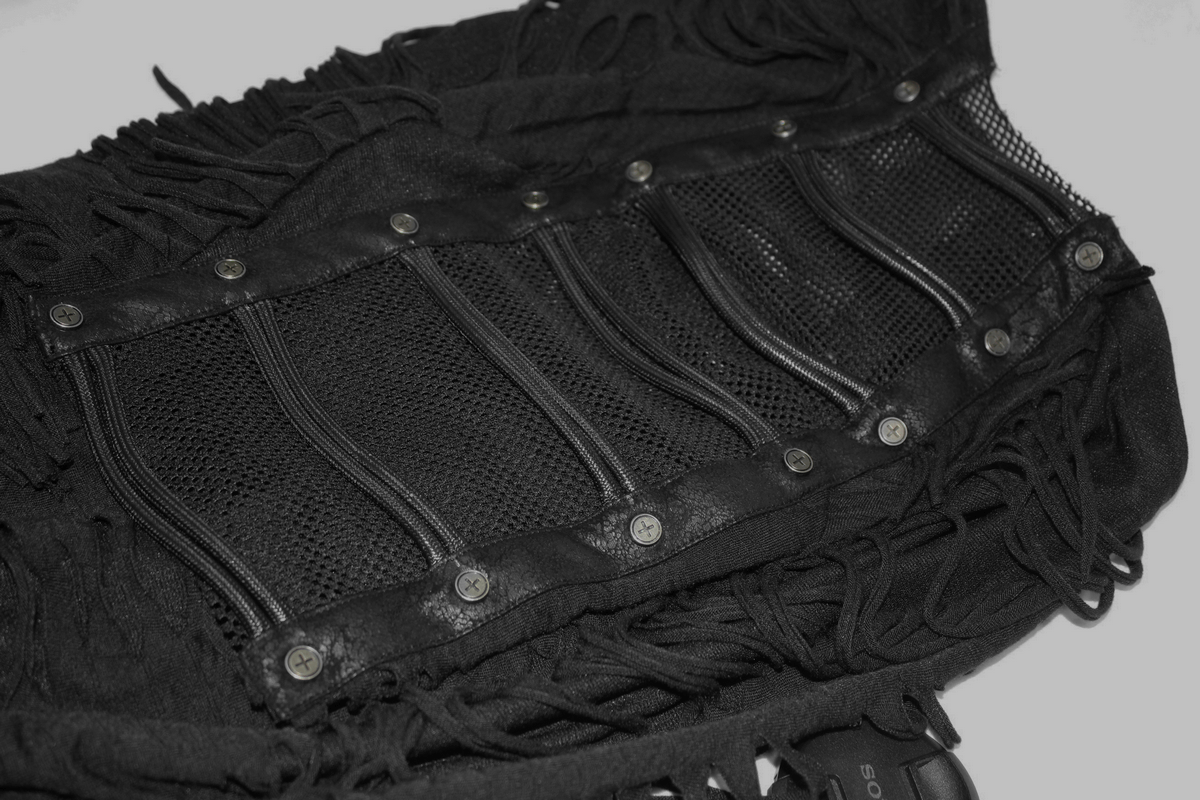 Close-up of a gothic black T-shirt featuring fringes, mesh panels, and studs for a stylish, edgy look.